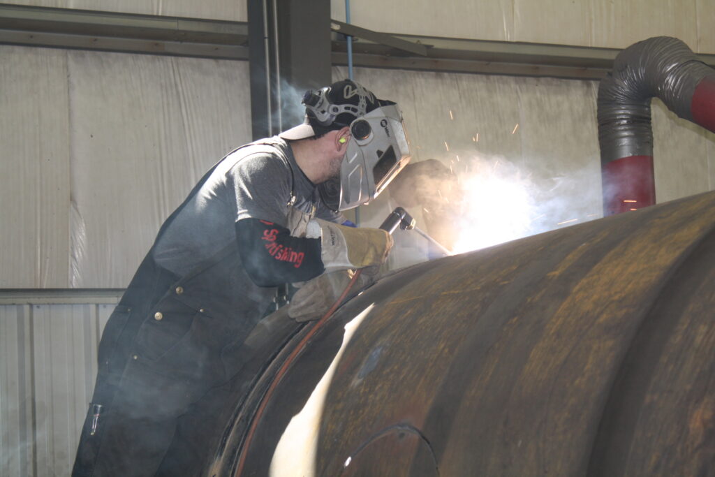 Baxter's Welding employee welding a Vertical Batch Sweetener